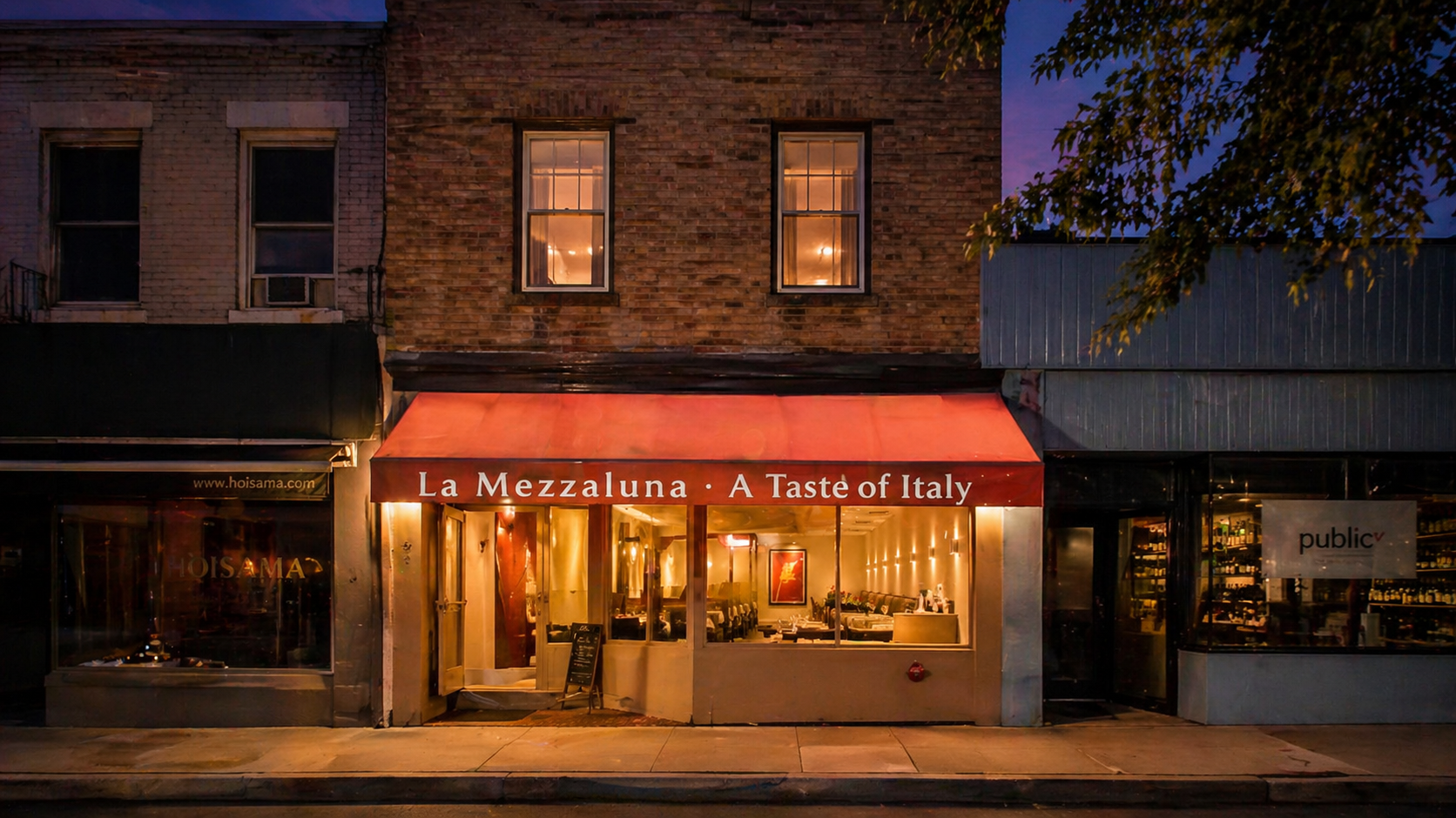 The La Mezzaluna storefront on Witherspoon Street at dusk.